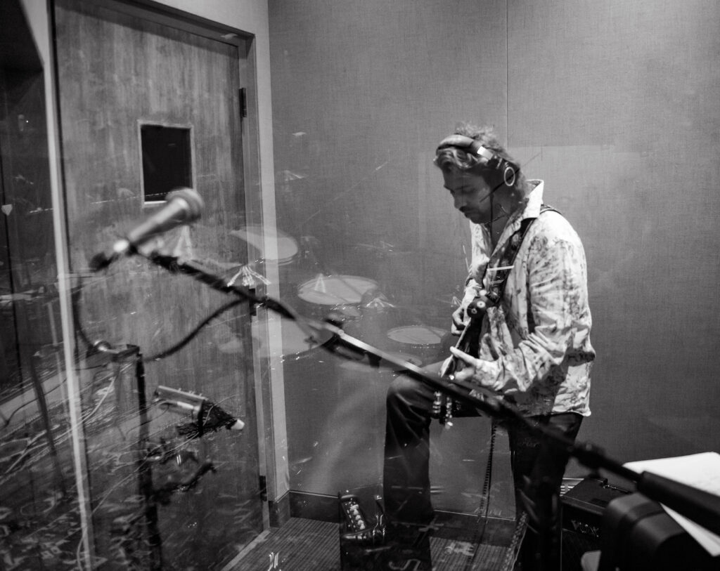 American Jazz Rock Guitarist Bobby Rozario playing in recording studio