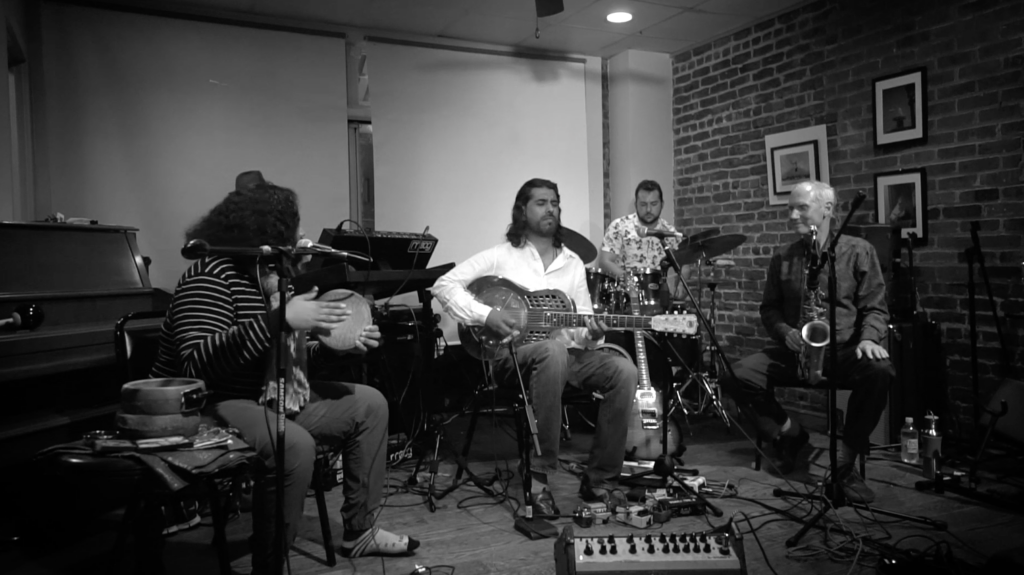 Bobby Rozario Jazz Rock Guitarist in studio with crew